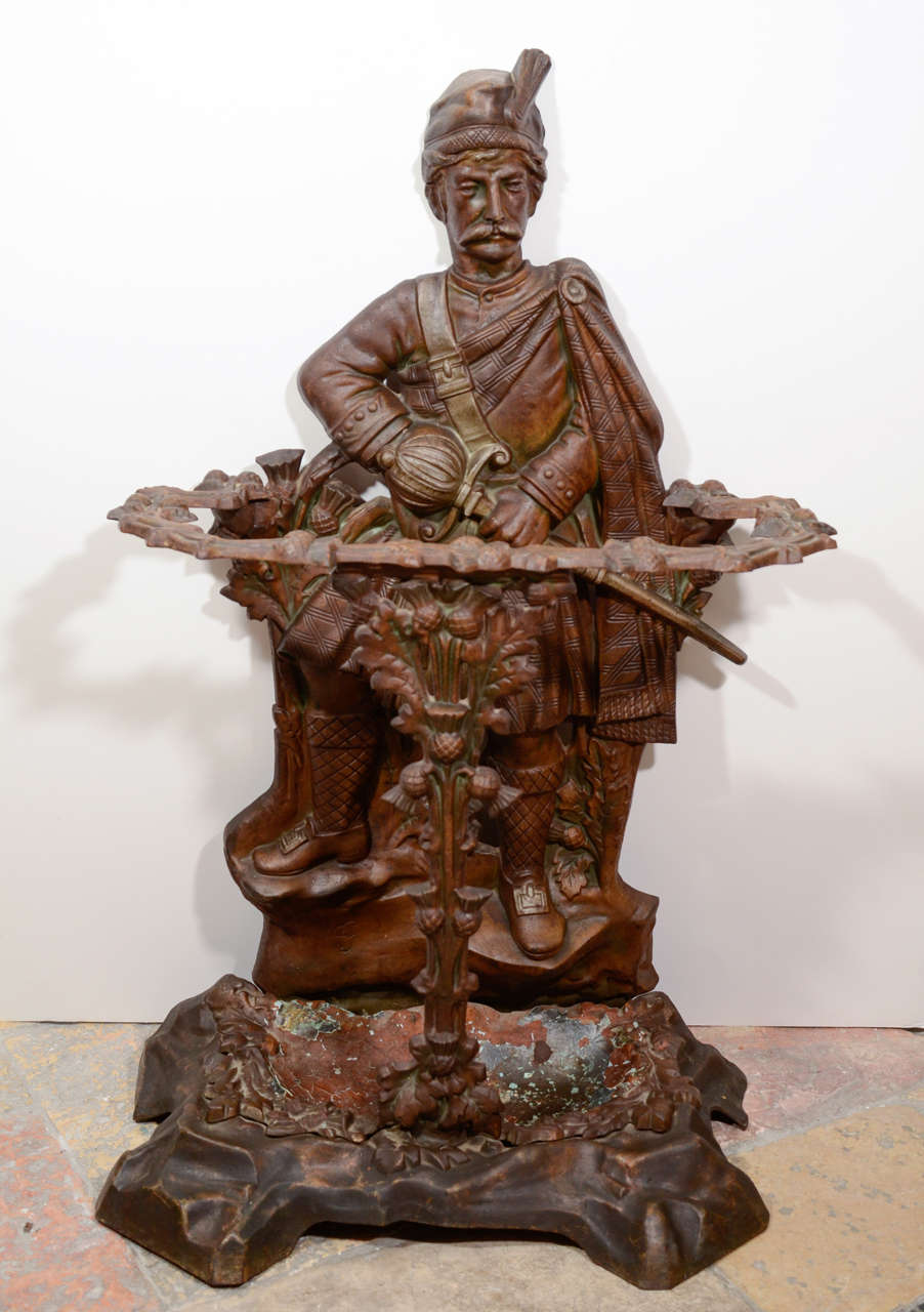 Cast iron Scottish soldier is the subject of this umbrella stand from the 19th century.  He has a foundry or sculptor's mark on the back: RS no 10458.  Highly detailed and In very good condition. This can be seen at our 5 East 16th St. store at