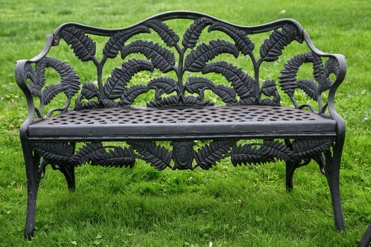A rare suite of cast-iron seating furniture, in the Fern pattern, comprised of a settee marked “McLean NY” and two armchairs.  Settee 29 ins. high, 45 ins. long, 19 ins. deep.  Chair 29 ins. high, 23 ins. wide, 19 ins. deep. 

This pattern a rare