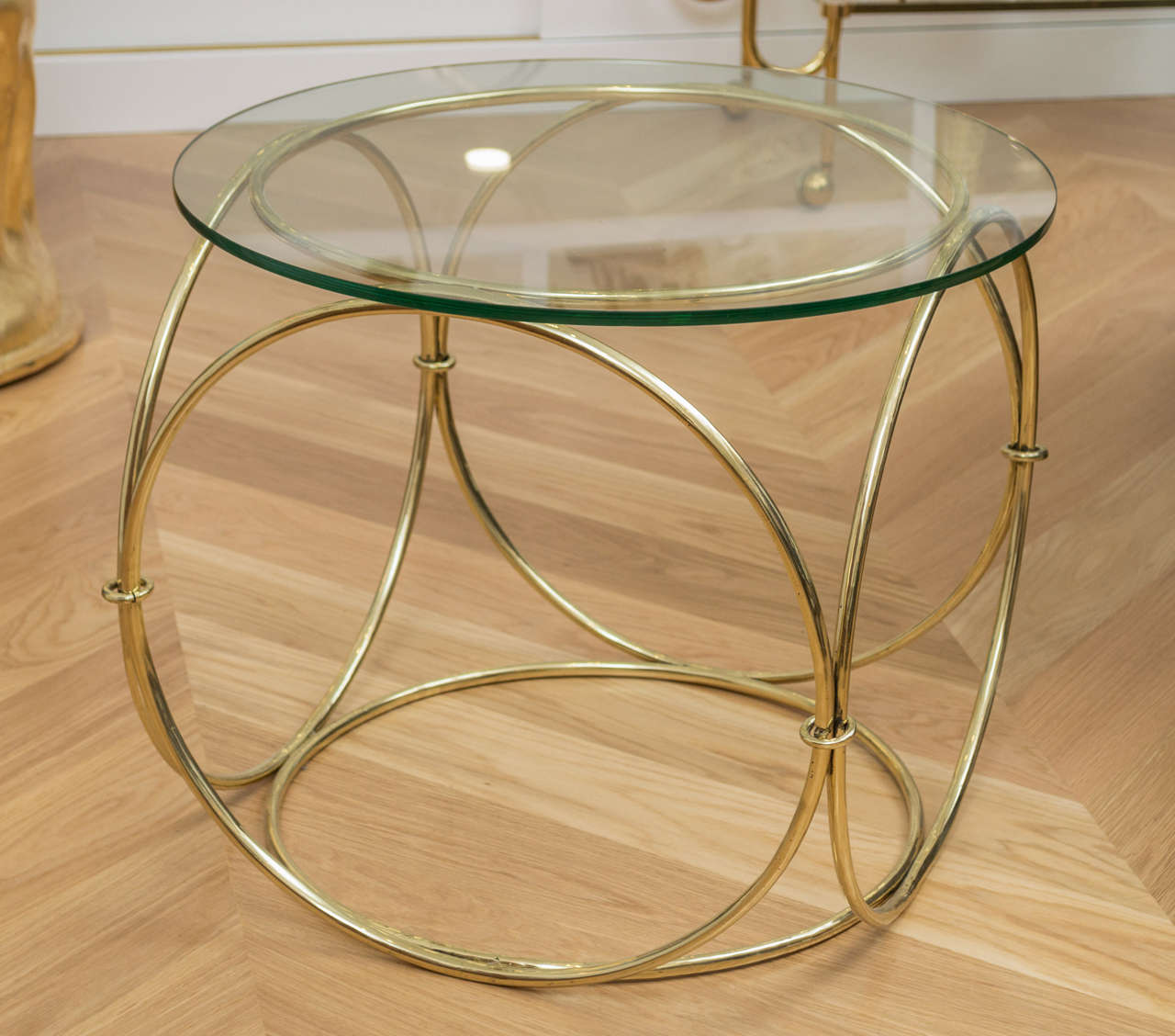 Beautiful polished brass occasional table with a glass top.