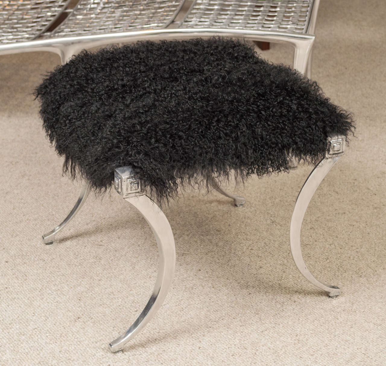 Polished  Kilsmos stool with a black Mongolian seat.