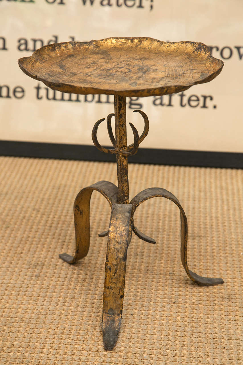 A very sweet French 1940's hand forged and gilded iron gueridon. It is also a perfect size for a plant stand or table centerpiece.