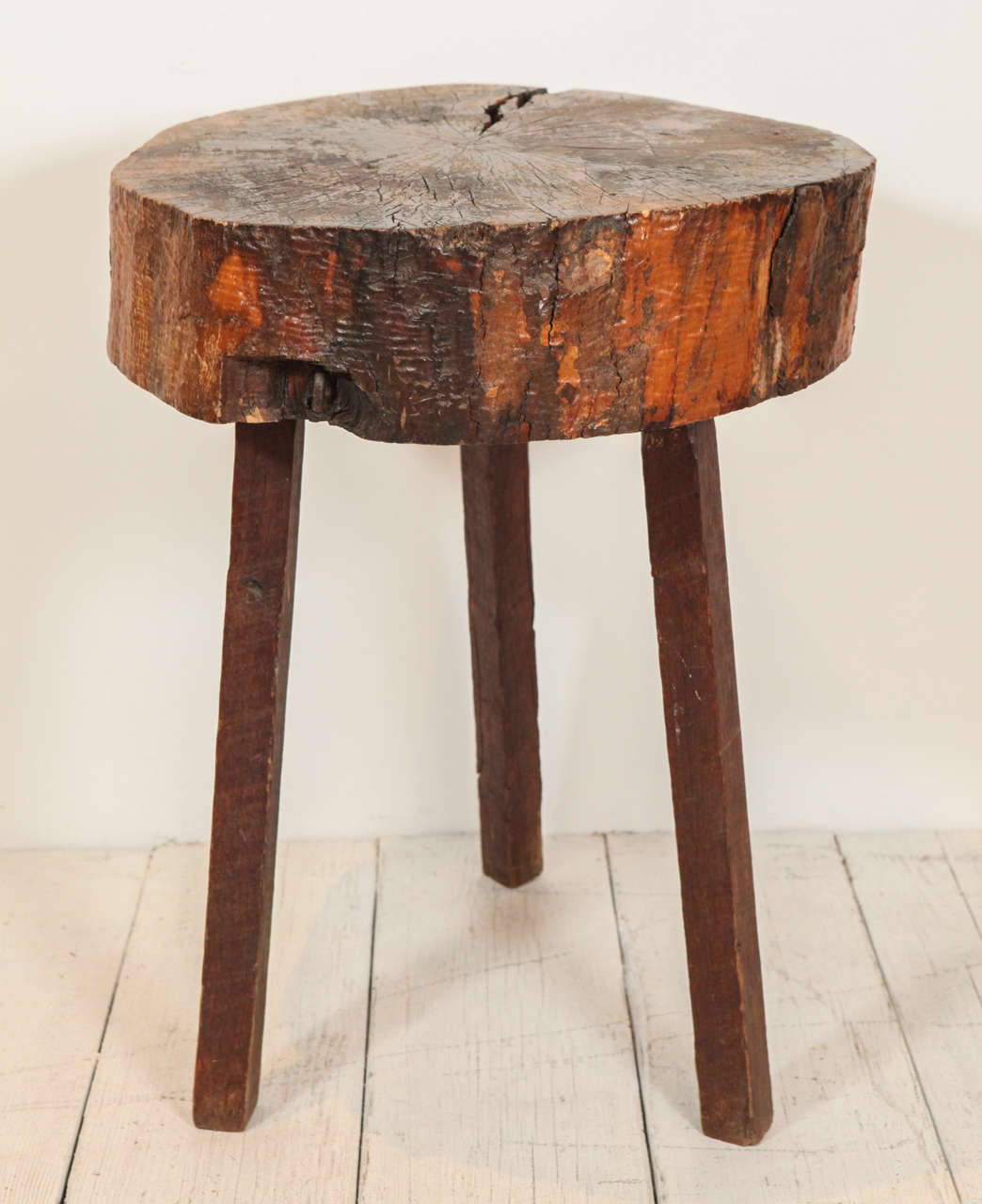 Beautiful chopping block style side table with large crack in top surface.