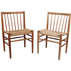 Set of Four Rush and Oak Dining Chairs in the style of Hans Wegner