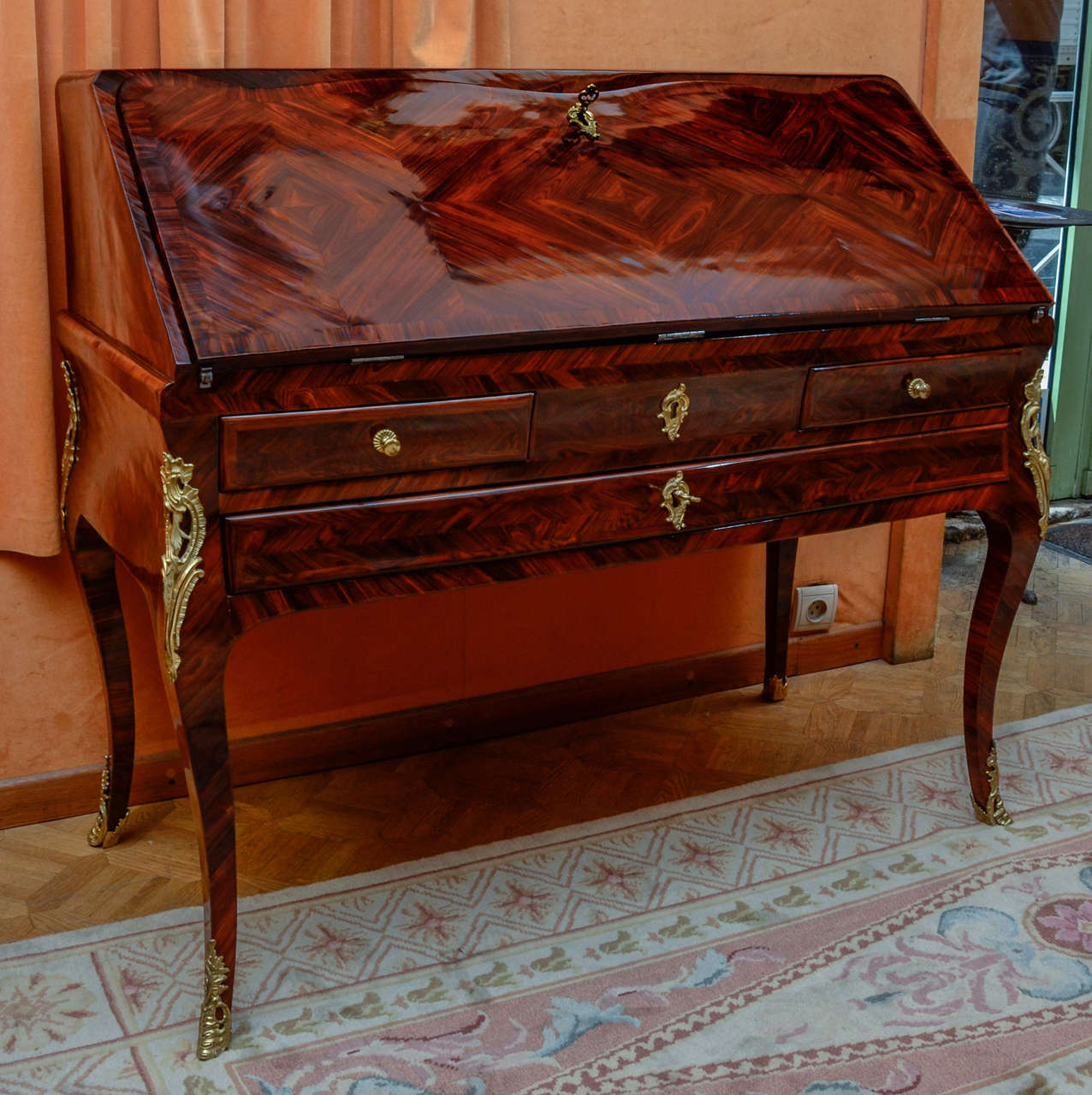A Louis XV  ormoulu mounted bureau en pente,  the fall front opening to a writing interior containing drawers and secret, on cabriole legs.