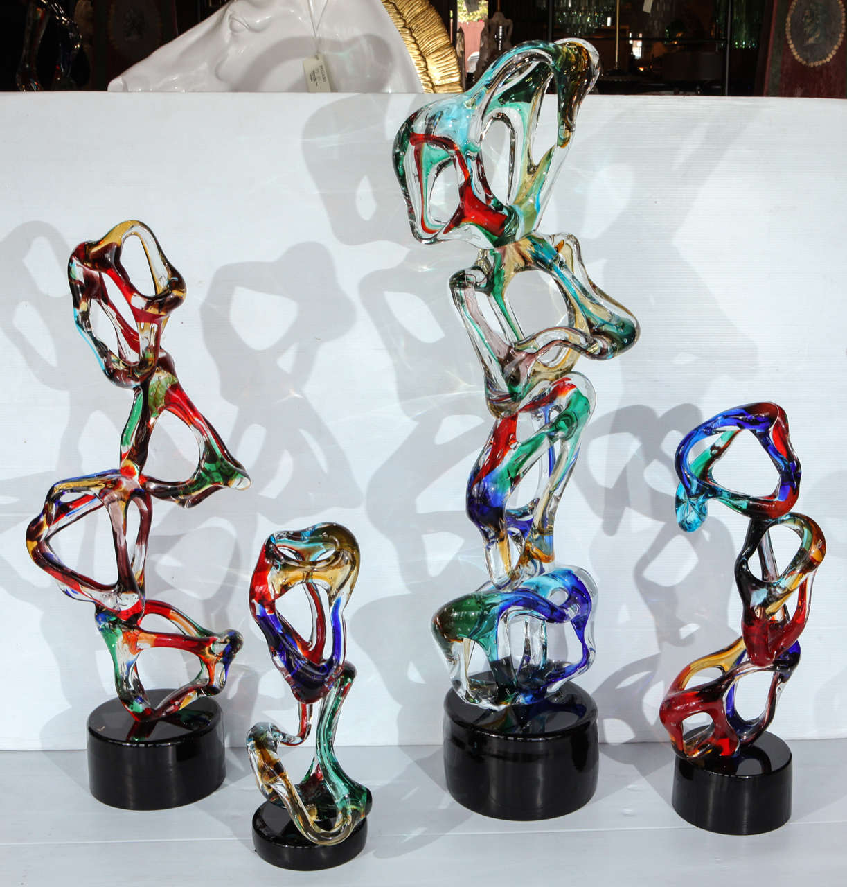 Abstract Set of 4 Italian Sculptures
Hand blown in Venice by Sergio Costantini (with original Murano sticker and a signature)
Dimensions (in the order from largest to smallest):
51.5