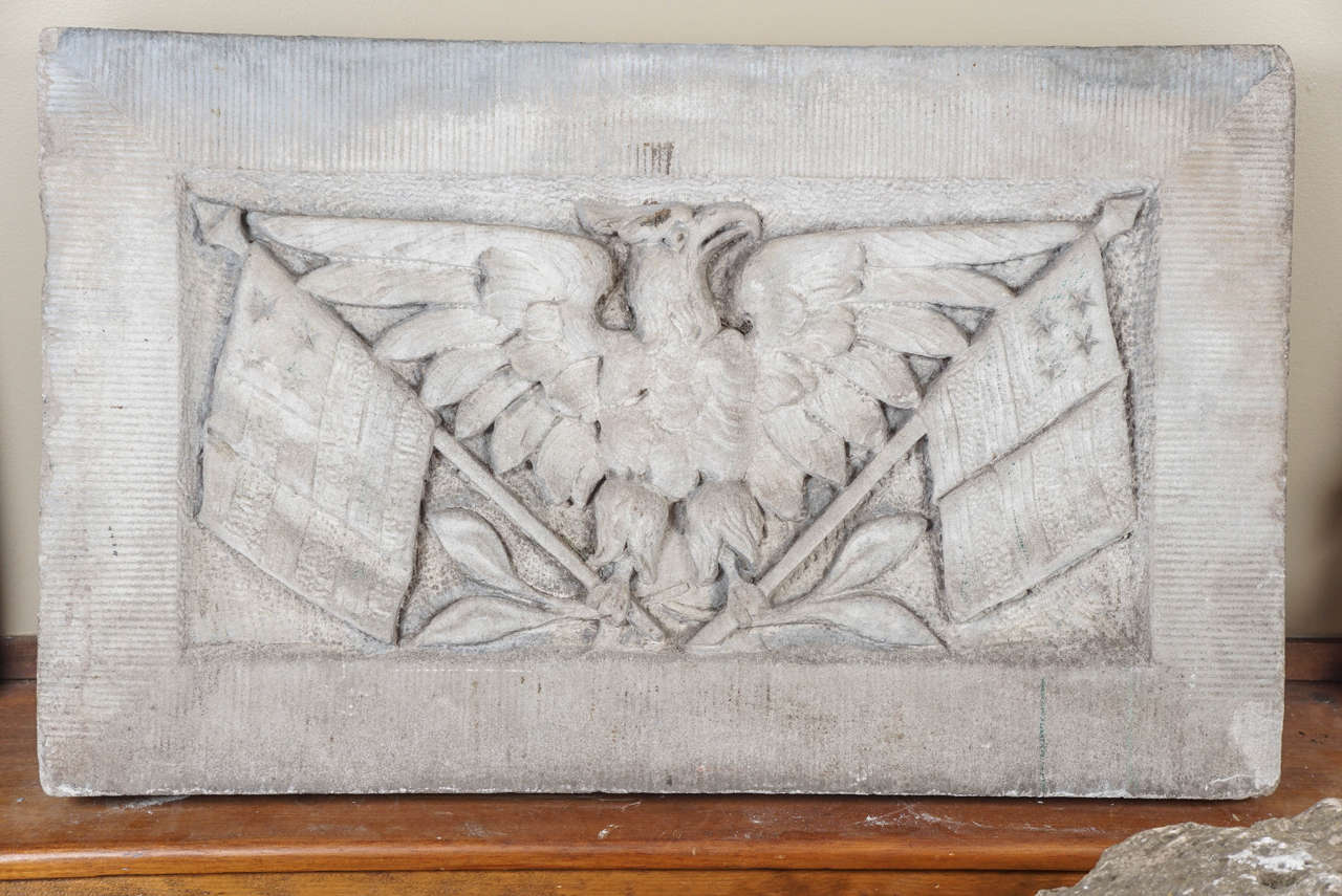 Rare Carved Limestone American Eagle Keystone, Wall Street NY, salvaged by Urban Archeology from a Wall St NY building constructed around 1900. Eagle clutching American flag and olive branches representing peace.