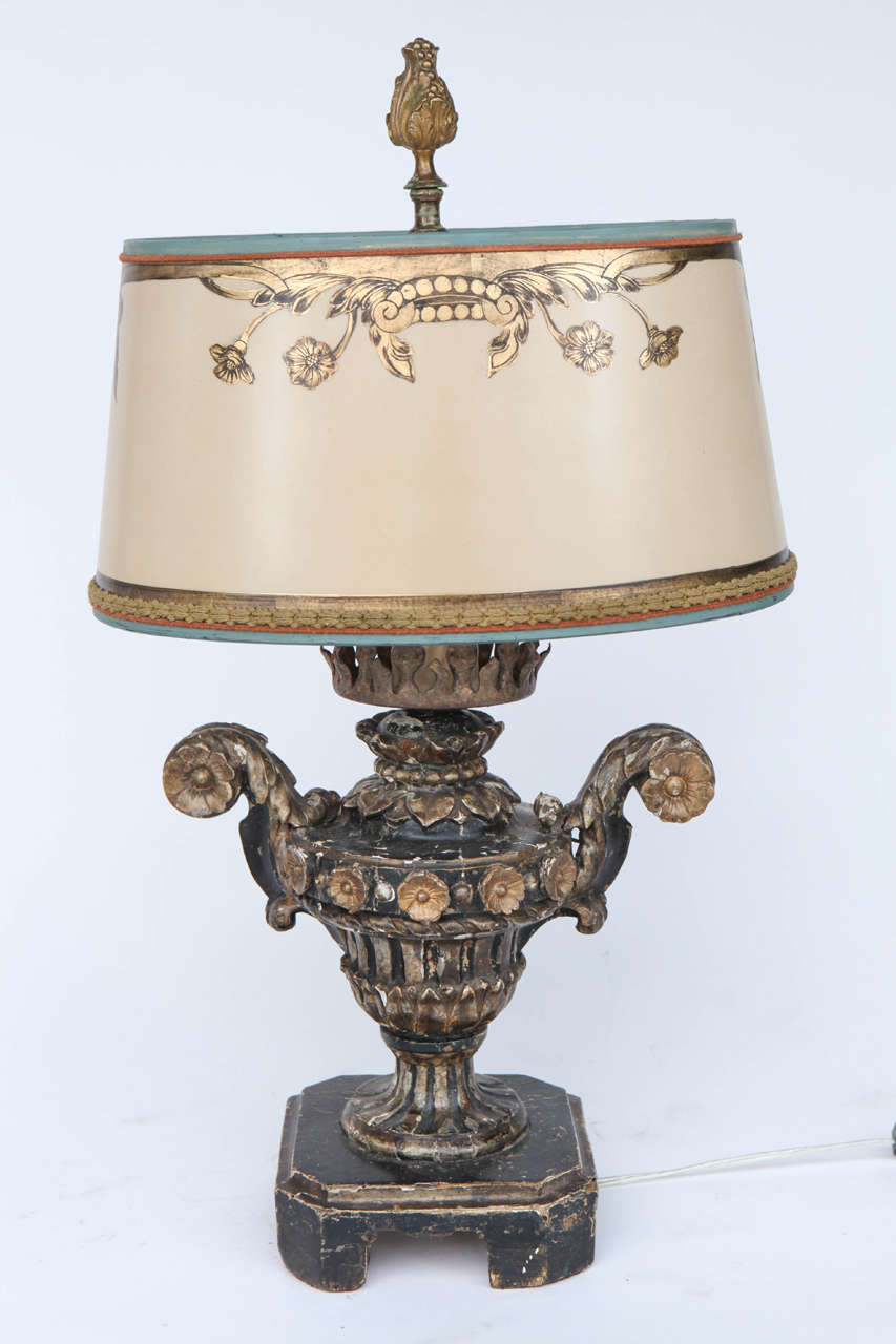 Pair of 19th c. Italian carved Giltwood Urn fragments converted to lamps.  The Shades are included and are Hand Made of Parchment Paper. They are Hand Gilded and Decorated. The lamps have been newly wired.