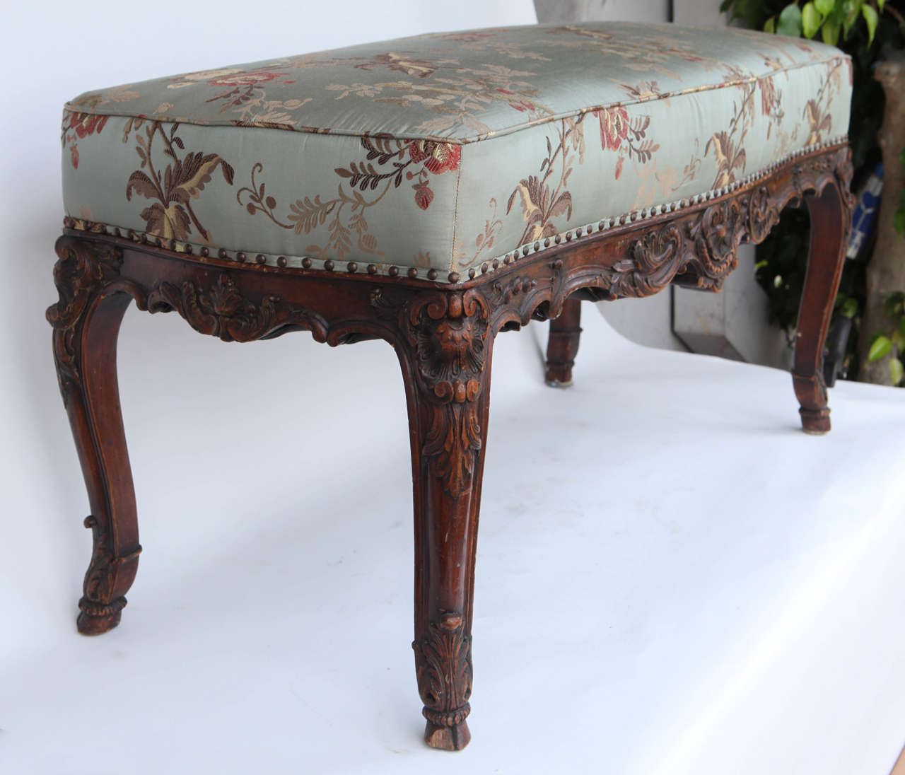 19th c. French carved Walnut Bench with Hoof Feet and finely carved Shell motif.  The silk fabric is from Decor de Paris.