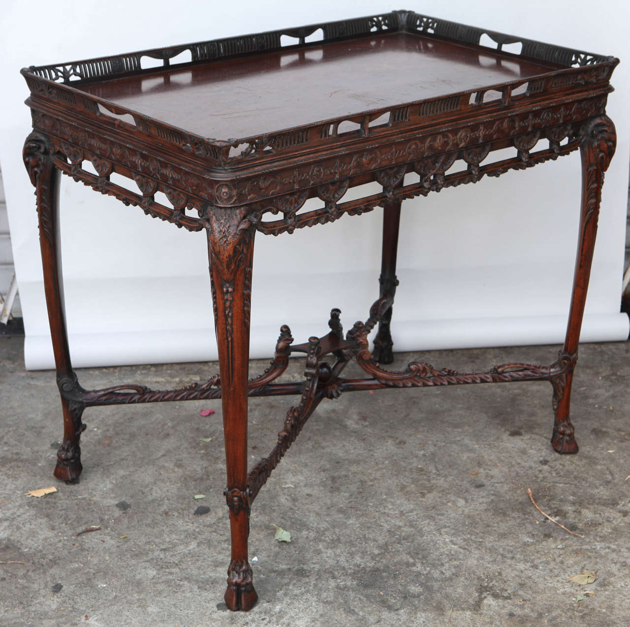 19th Century English Carved Mahogany Table with Stretcher