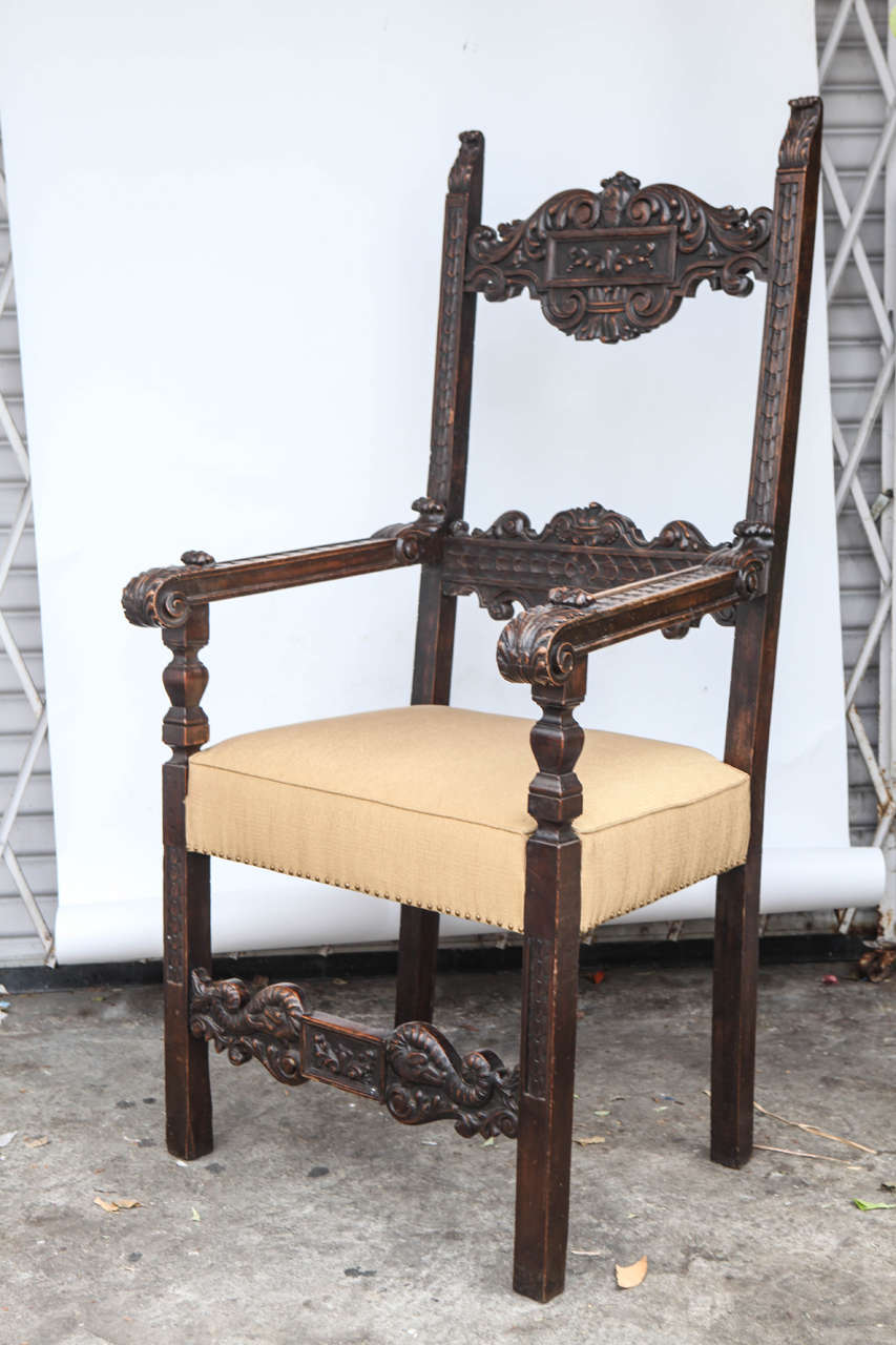 Pair of 18th century Italian carved walnut throne chairs with nailhead detail.