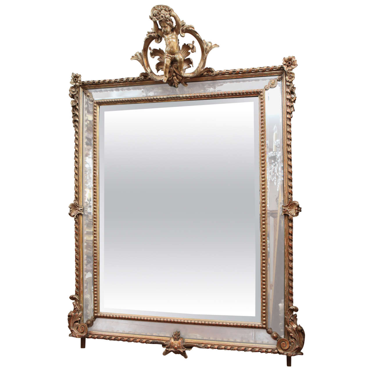 Miroir en bois doré à double encadrement du XIXe siècle avec chérubin sur la couronne
