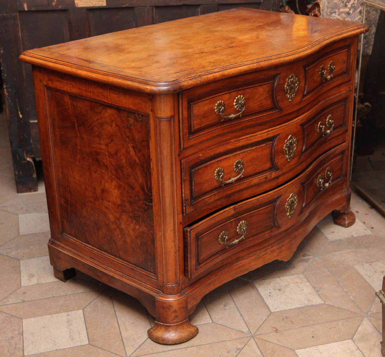18th c. French Walnut 3 drawer Serpentine Commode with brass hardware.