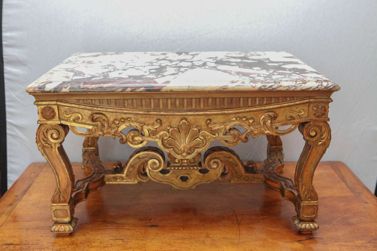 Finely carved giltwood side/coffee table with original marble, which is very pretty. Detailed. Strong. Not wobbly.