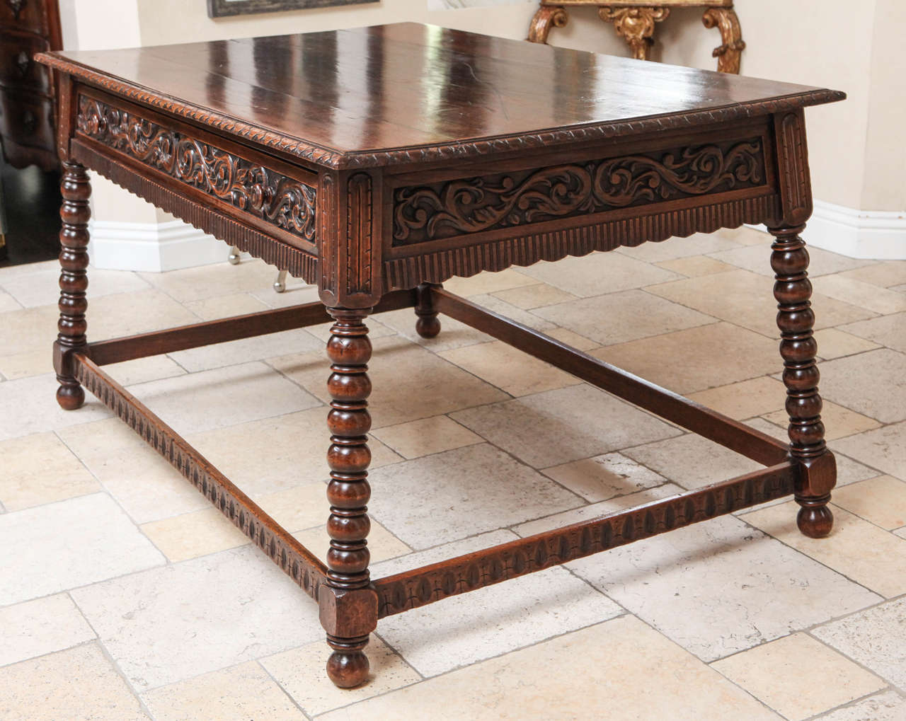 19th century Italian walnut library table with single drawer. The table can be floated in the middle of a room as it is beautifully carved on all sides.