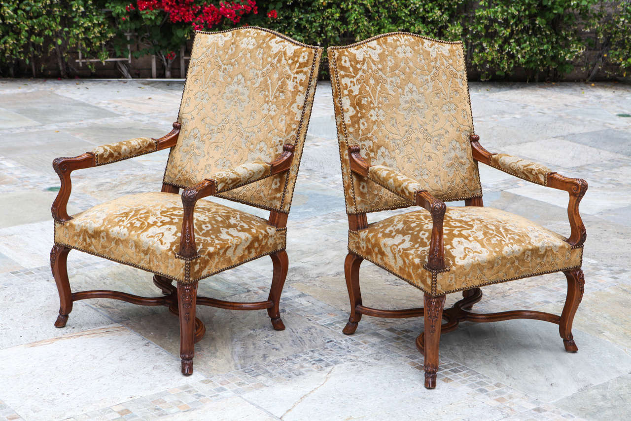 Pair of 19th century French walnut armchairs with fine carving and hoof feet. The price quoted below is for a pair but there are two pairs in total available.