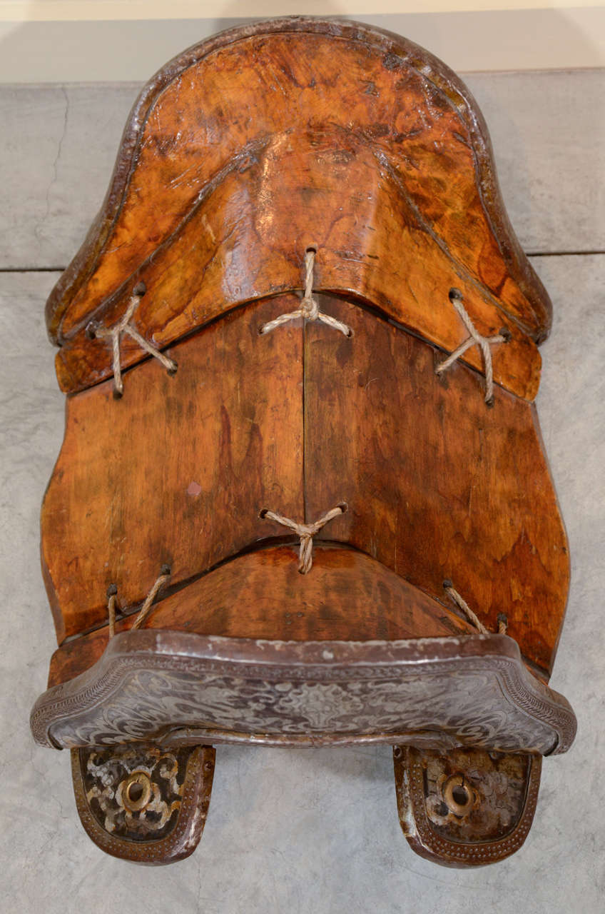 A beautifully engraved Tibetan horse saddle with nicely worn beech wood seat. Lhasa, Tibet, circa 1920.
M2005
abhayatribeca.com