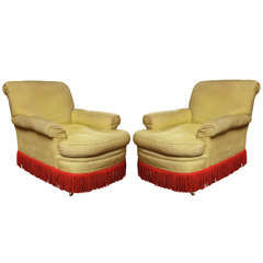 Pair of uphostered chairs with original fringe. 