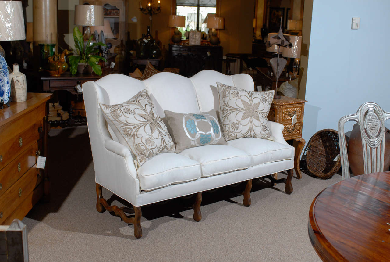 Louis XIII Style Sofa in Beechwood, Circa 1950
We just had this sofa recently covered in muslin - it shows off the great lines. Now it is ready for your choice of fabric.  It is a good sturdy frame made in the 50's and sits comfortably.