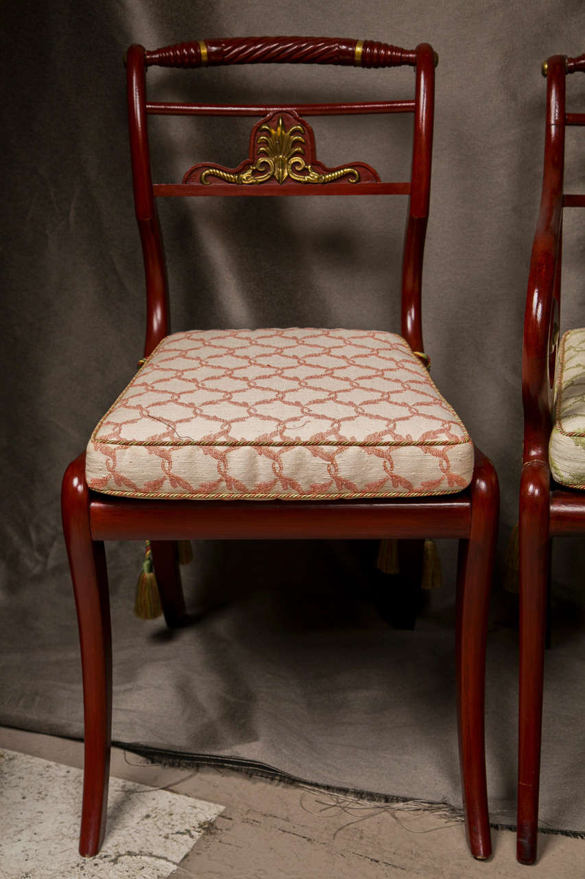 Set of Twelve Red Painted Maison Jansen Dining Chairs.