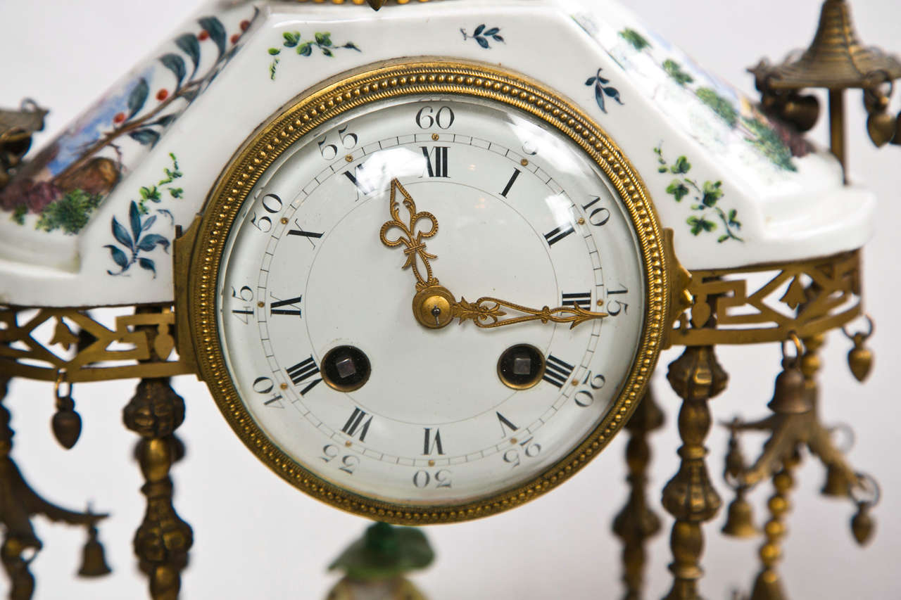 Antique 19th century porcelain and bronze table clock in the shape of a pagoda. Marked J.E.Caldwell & Sons Philadelphia, made in France on the reverse. In the taste of Meissen.