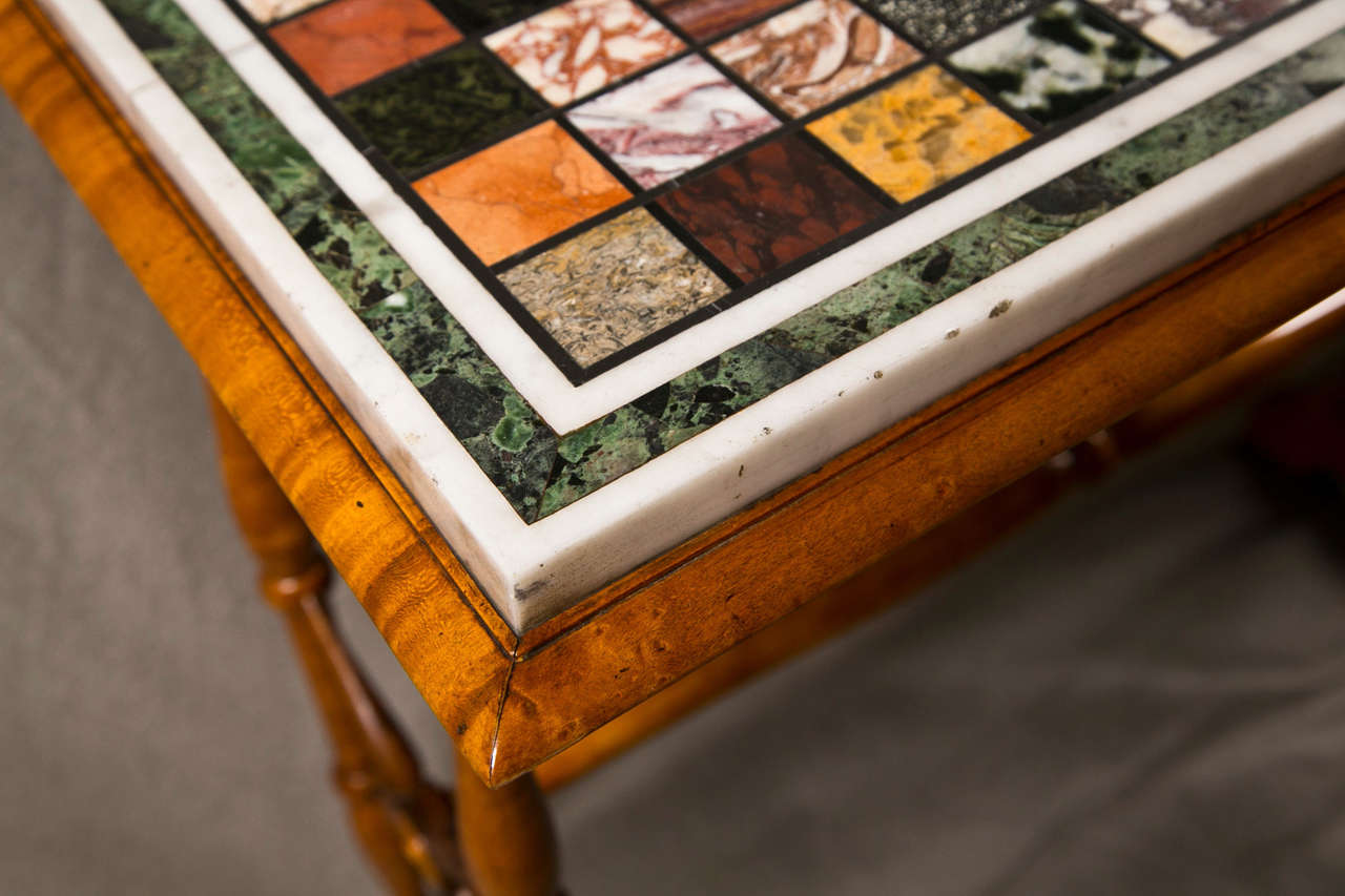 Finest Regency period speciman top side table. The bamboo form yew wood legs having X form design sides with a double twist center carraige leading to a wood famed fine speciman top of colored boxes framed in white and black marble work.