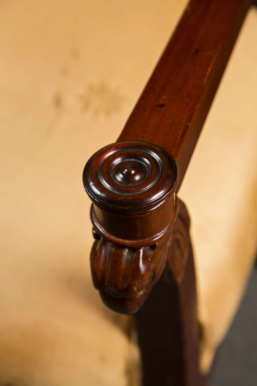 Finely silk upholstered Russian neoclassical fauteuil chair. This fine chair, circa 1820 has a very masculine look as the curved straight legs lead to a Russian Federation Eagle. Wide seats leading to a solid square back. From a fine Park Avenue