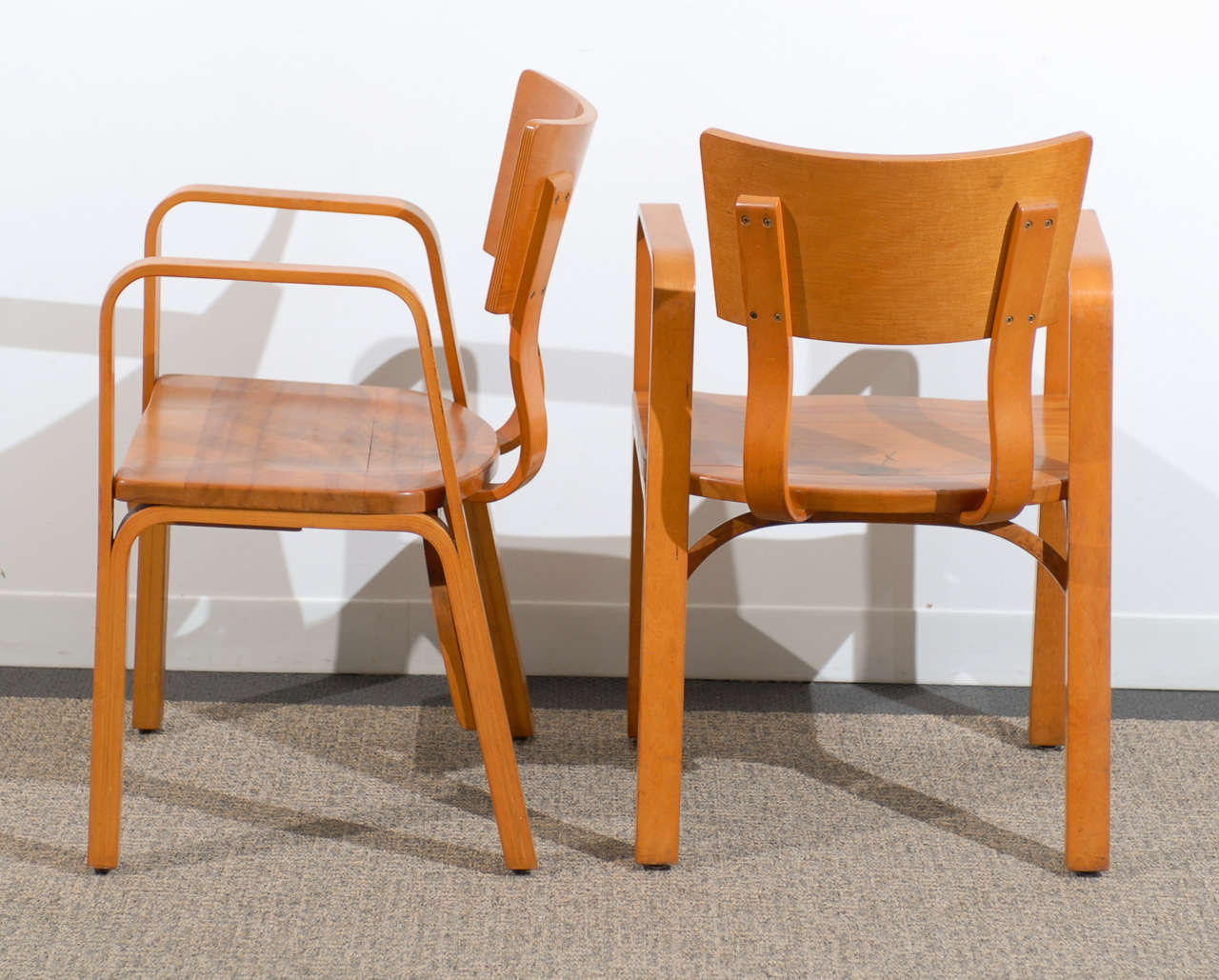 Mid-Century Modern An Unusual Pair of Bent Plywood Arm Chairs by Thonet