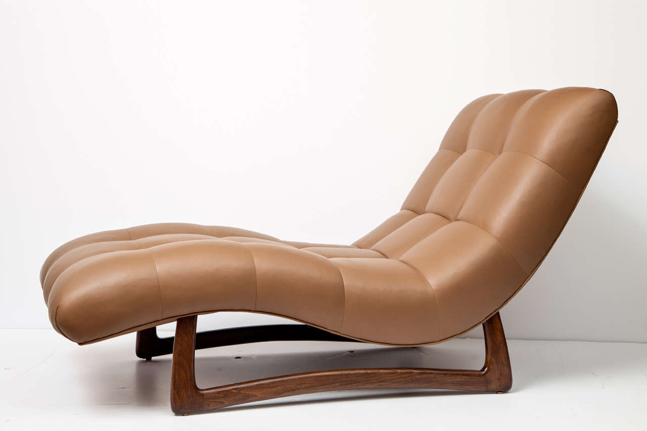 Very comfortable and decorative chaise lounge from c 1950. Reupholster in ultra leather from Japan.