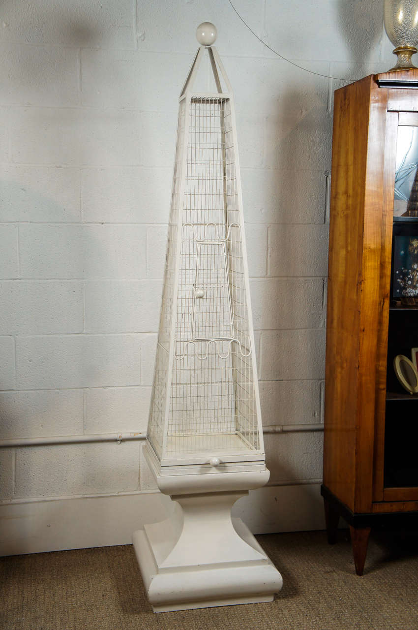 Here is a wonderful obelisk birdcage by Frederick Weinberg.