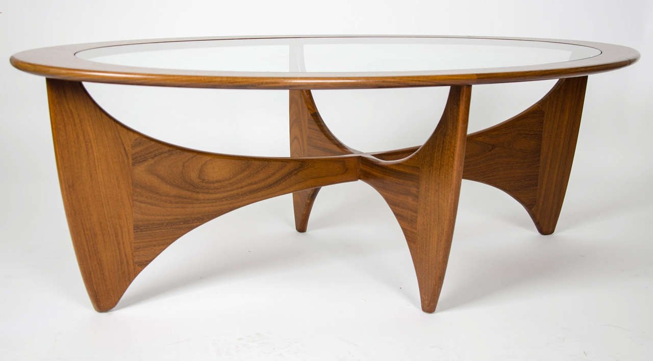 A British G-Plan oval shaped teak with inset glass top coffee table. A Kofed Larsen design.