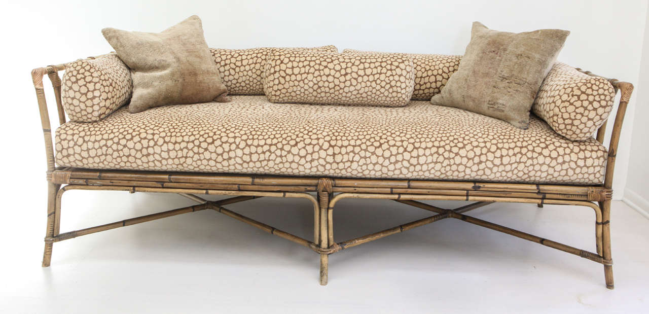 With its criss-crossed base and dramatically low back, this piece is truly magnificent! We've recently reupholstered the daybed in this incredible Donghia fabric - an homage to the animal print. Daybed includes five custom-made bolsters, made here