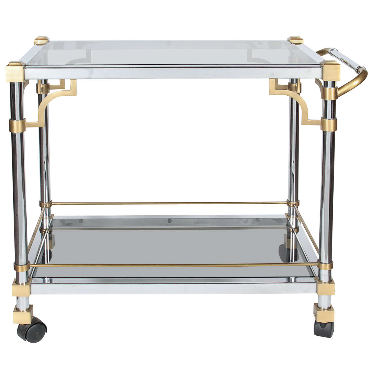 A Minimalist, mid century modern two tone bar cart, attributed to Maison Jansen. The frame in gilt bronze and polished nickeled iron is both structural and highly decorative and is influenced by the Anglo-Japanese style. It features a heavyweight