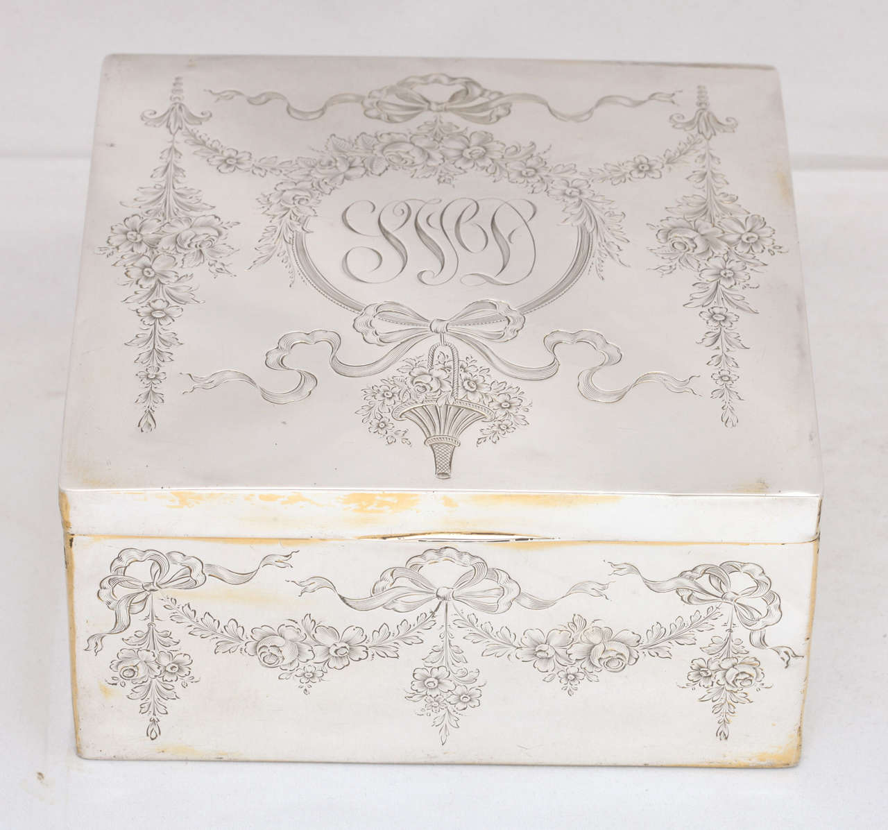Large, sterling silver, hinged jewelry or table box, The Gorham Corp., Providence, Rhode Island, circa 1895. Beautifully etched with flower garlands, ribbons, bows and flower baskets. Cartouche is monogrammed (