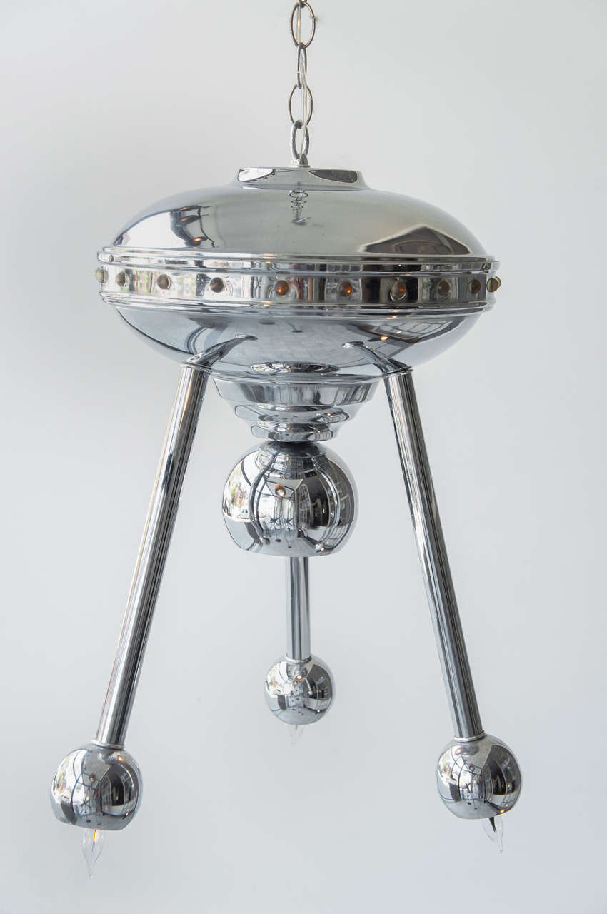 fanciful hanging light - UFO Spaceship - 3 way switch for center down light and sockets in the 3 legs - light also shines indirectly through the band of tiny round windows - 2' chain with canopy