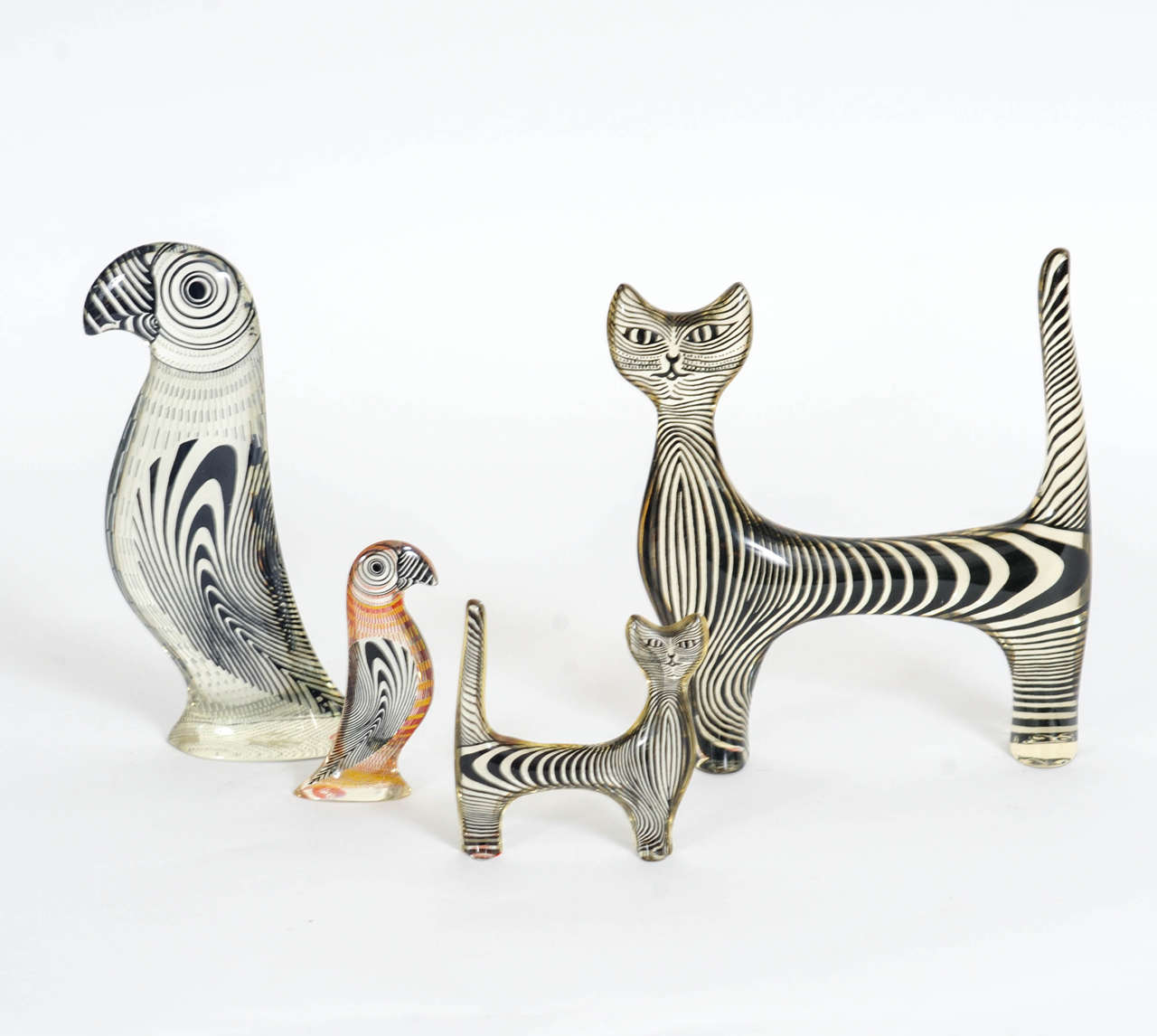Striking combination of two black and white cats and two puffins (big one in black in white, small one in technicolors) designed by Abraham Palatnik.

The belox mentionned dimensions are valid for the big puffin.
The small puffin: 10 cm high x 4