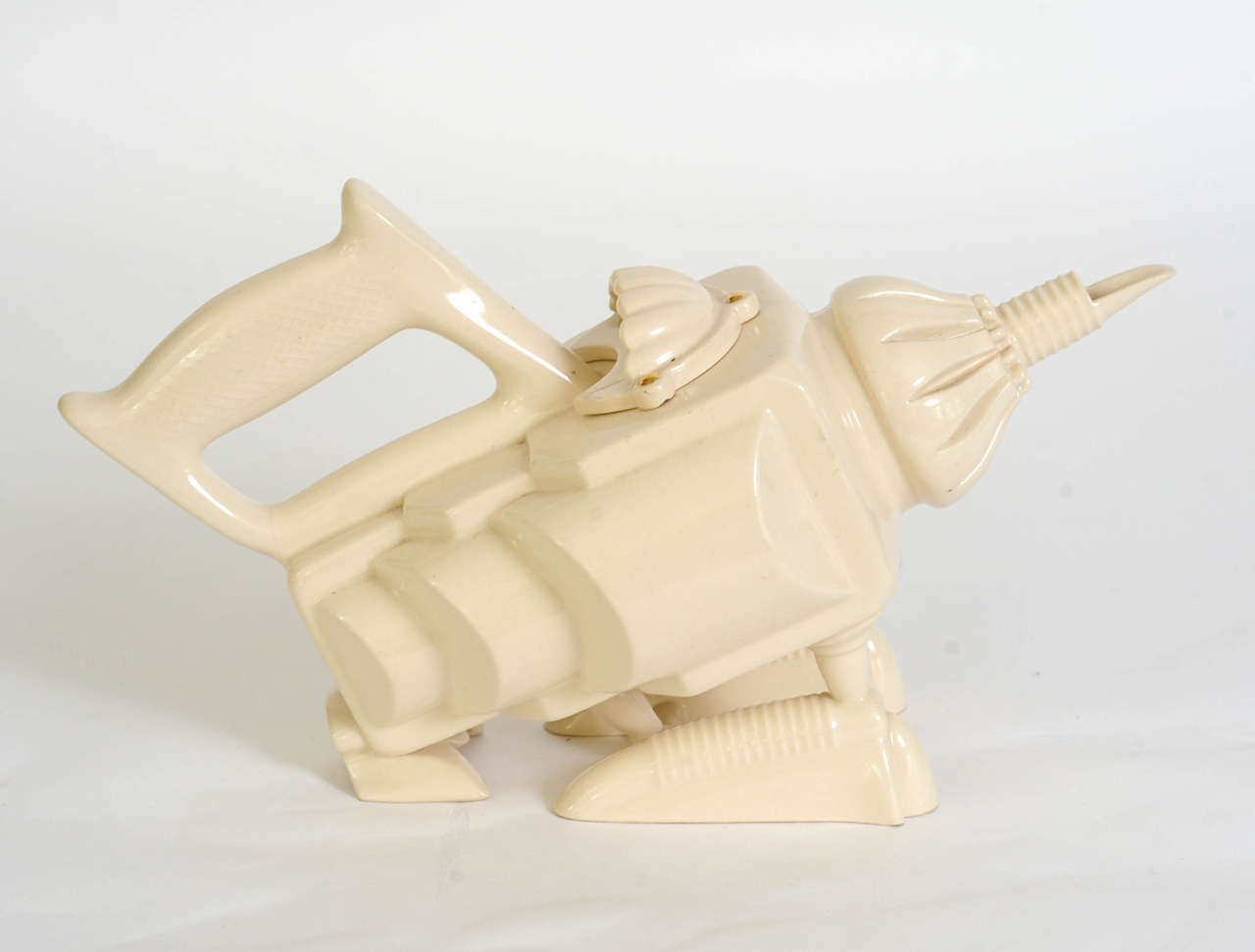 This cheerful cream colored teapot is like having a wingless water plane on your coffee table.
Its basis consists of two 