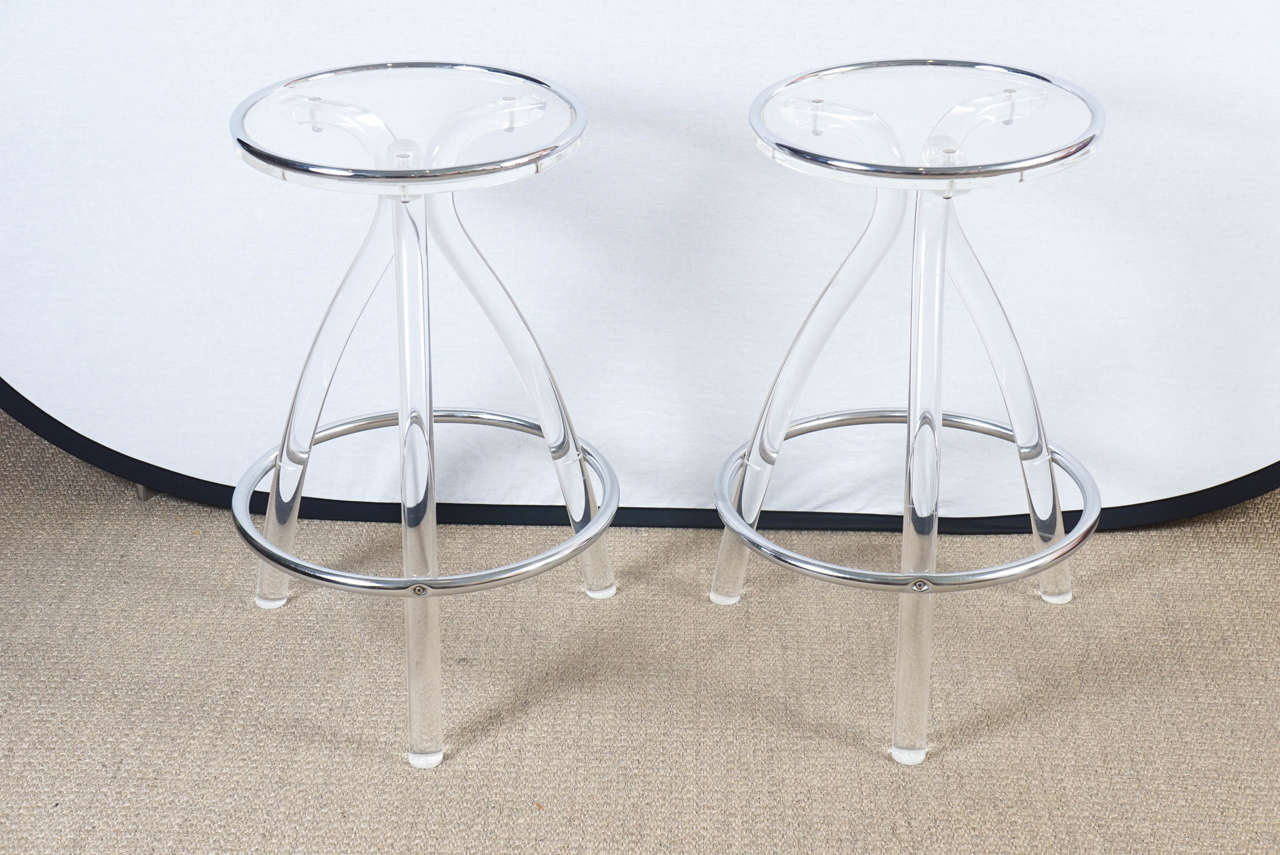 Great pair of lucite barstools with chrome surround.