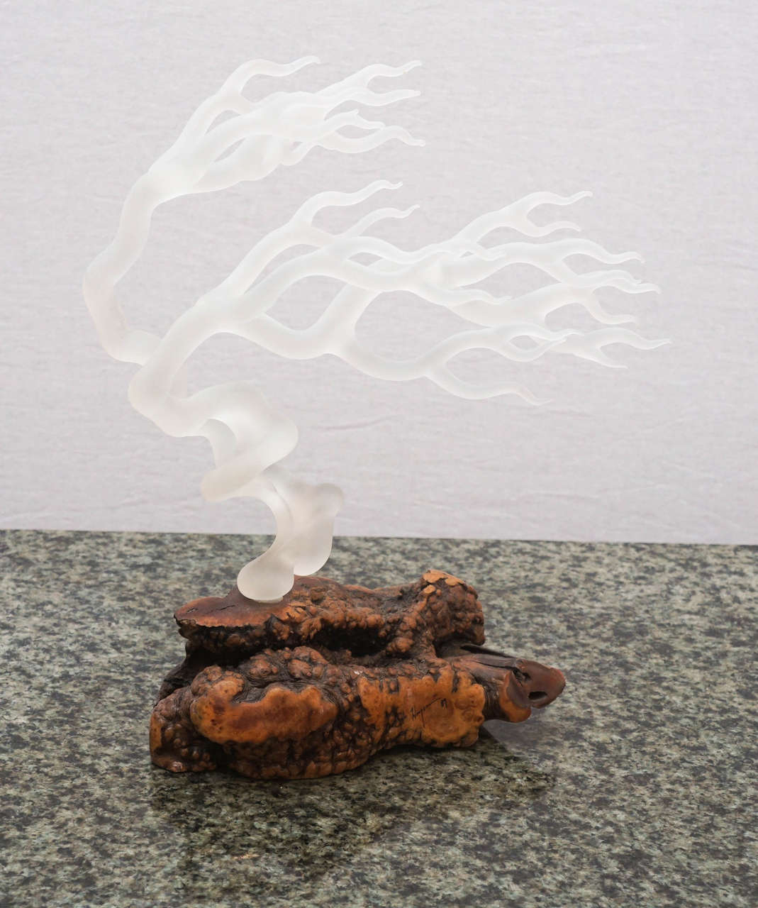 Elegant frosted glass tree sculpture with a root base.