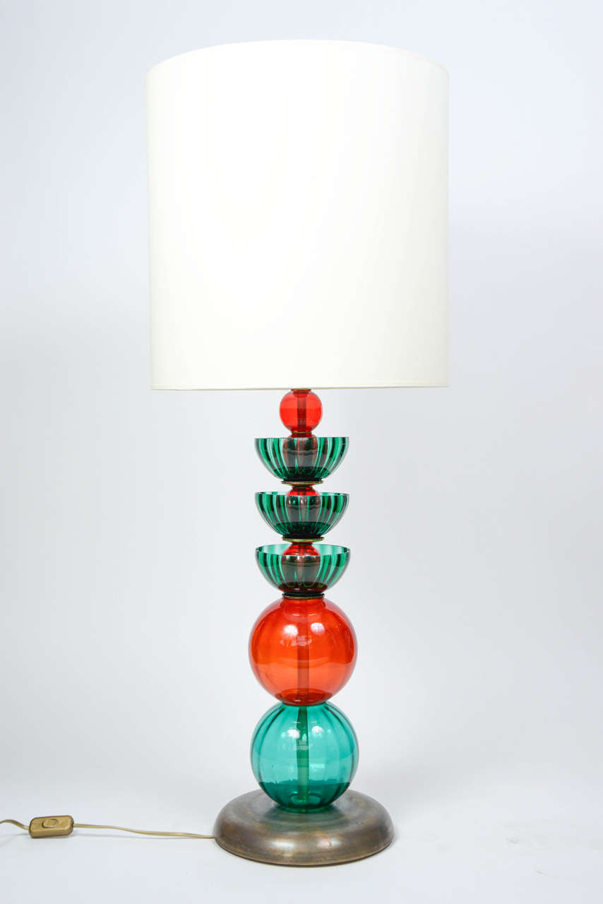 Nice pair of lamps made of brass feet and Murano glass pieces.