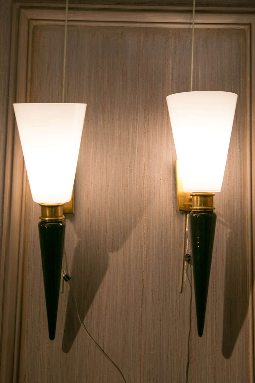Set of four Murano glass sconces black and white, brass basement.