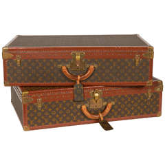 Ein Paar Louis Vuitton-Alzer-Koffertruhen im Vintage-Stil