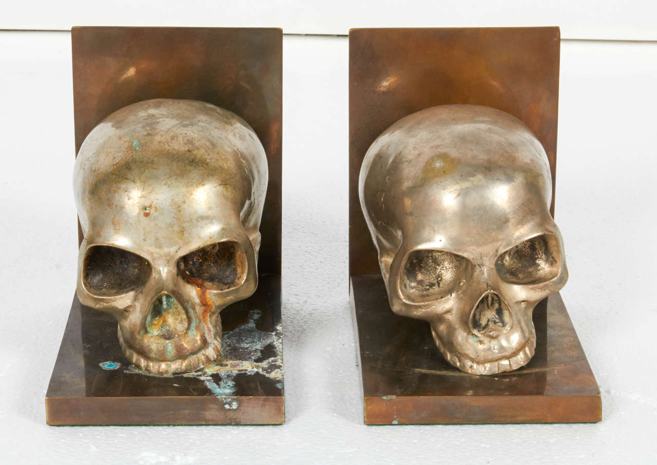Silver plated skulls on brass base. Signs of oxidation.

Not available for sale or to ship in the state of California.