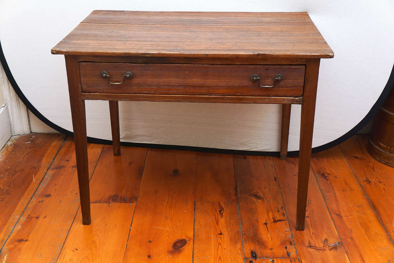 American pine single drawer side table with simple drawer pulls. 
Possibly made up of parts, but handsome simple design.