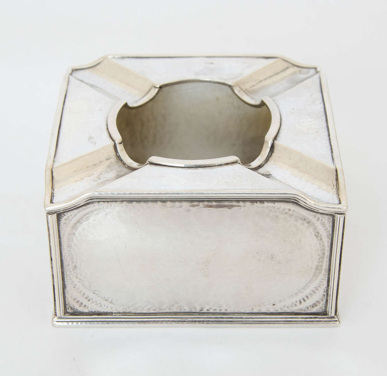 An Omar Ramsden cigar ashtray, made in London 1929.
Omar Ramsden is recognised as a master in the field of silver design and his pieces feature in most good collections of 20th century design. Along with his iconic or makers mark this piece is also