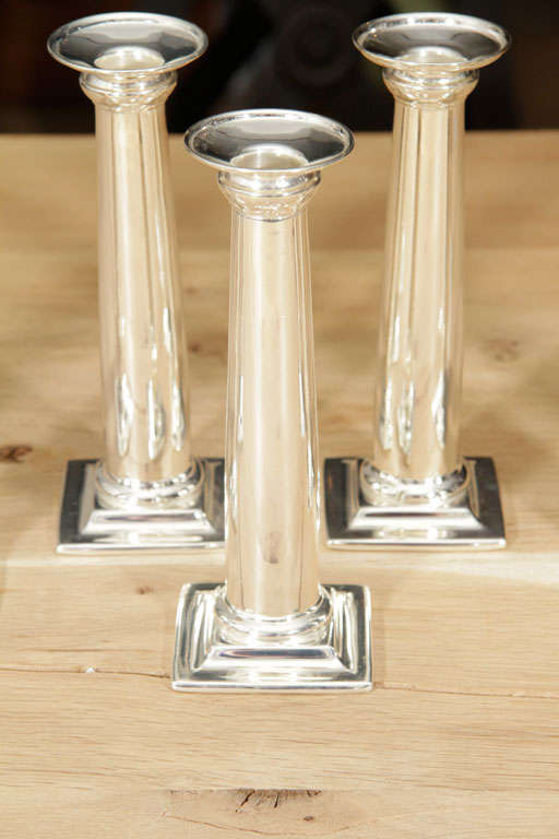 Antony Todd collection silver candleholders.