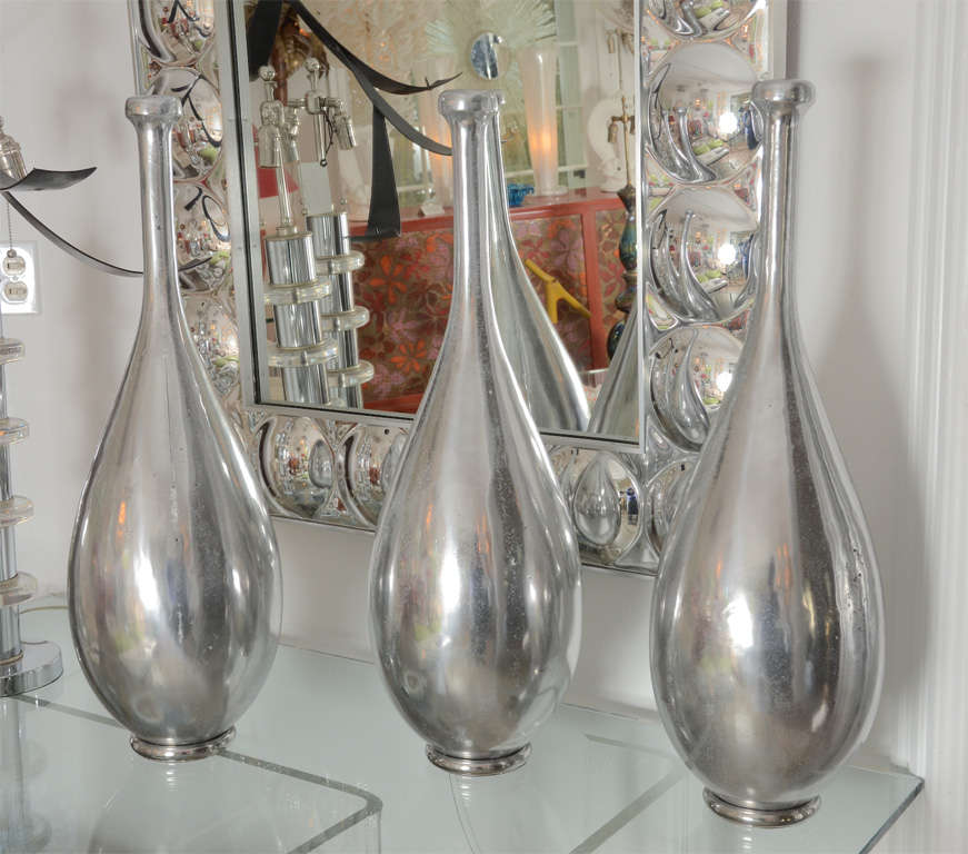 Cast aluminium sculptures in the form of bowling pins or 19th century exercise pins. Priced individually.