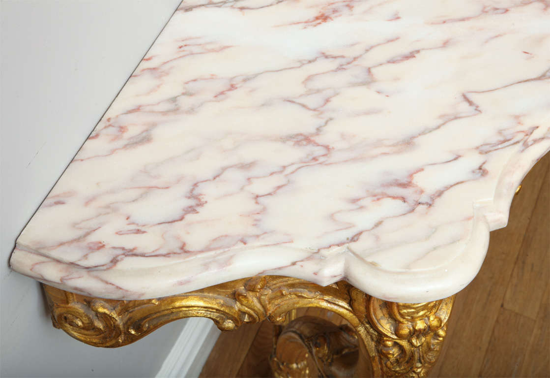 Marble A pair of French Louis XV style wall mounted console tables