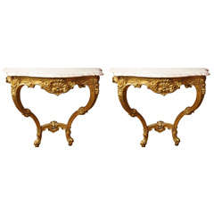 A pair of French Louis XV style wall mounted console tables