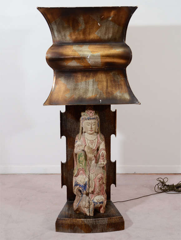 Amazing Rare Pair of Original Asian motif, monumental table lamps by James Mont. Each has a carved sculpture of a bodhisattva beneath the original gold and silver leaf shades.