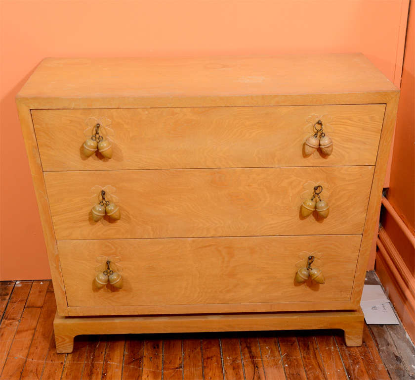 A vintage three drawer dresser by Johan Tapp. Each of the drawer pulls is in the shape of acorns